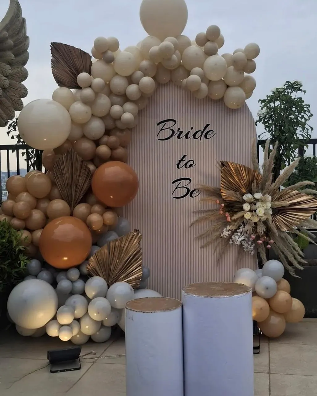 Neutral boho bride to be balloon arch with pampas grass