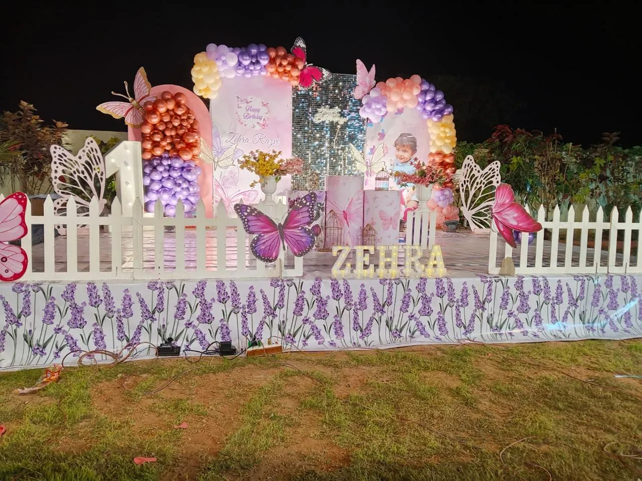 Garden butterfly stage lit at night
