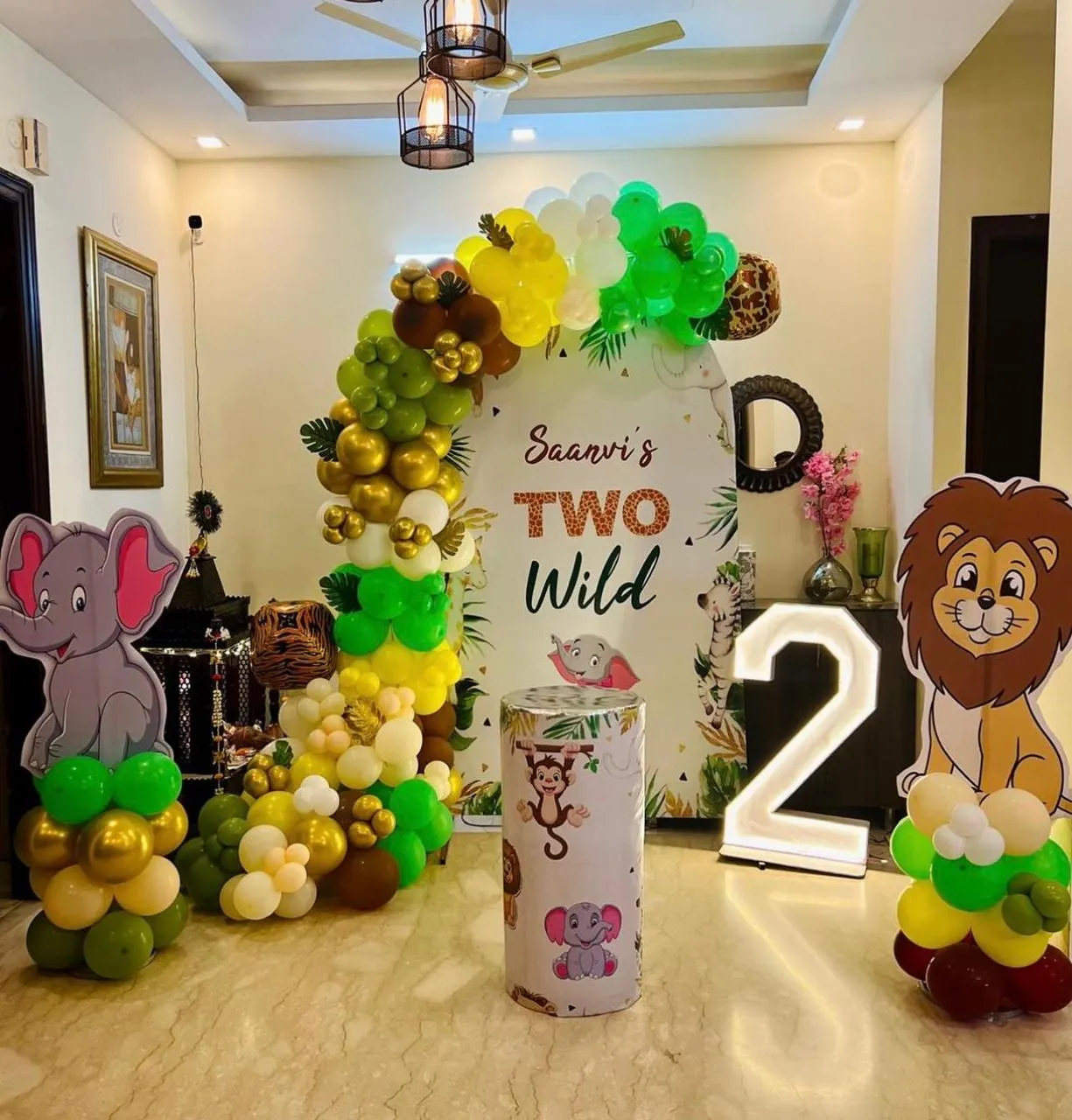 Jungle theme with animals sides , baloons , cake table and LED age number.
