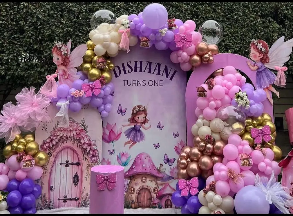 Pastel fairy and butterfly themed first birthday backdrop