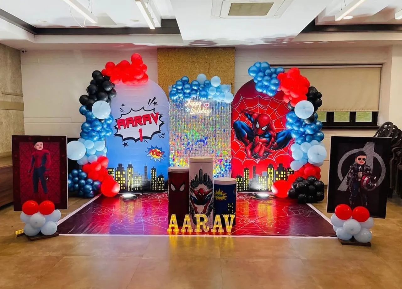 Spider man theme with balloons, LED name & age, Entrance balloon arch , 2 baby cutouts and lights.